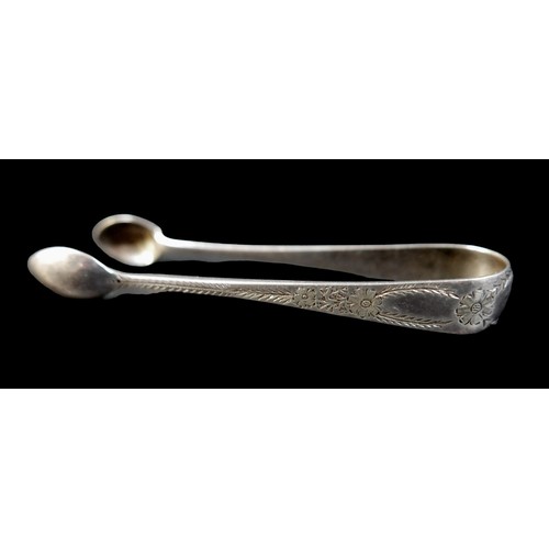 9 - A set of twelve silver teaspoons, G.M.J., London 1895, together with two silver sugar nips, a silver... 