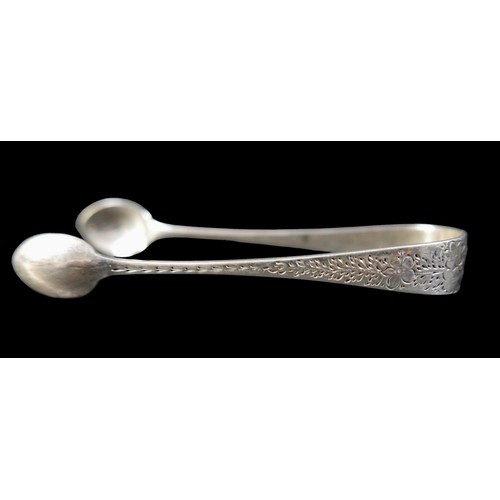 9 - A set of twelve silver teaspoons, G.M.J., London 1895, together with two silver sugar nips, a silver... 