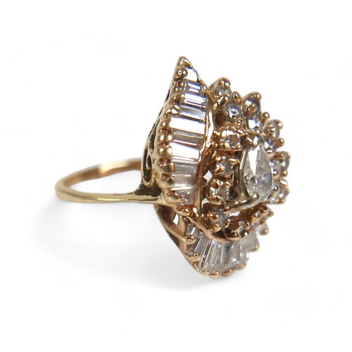 95 - A 14ct yellow gold and diamond cluster dress ring, circa 1970s, set centrally with a pear cut diamon... 