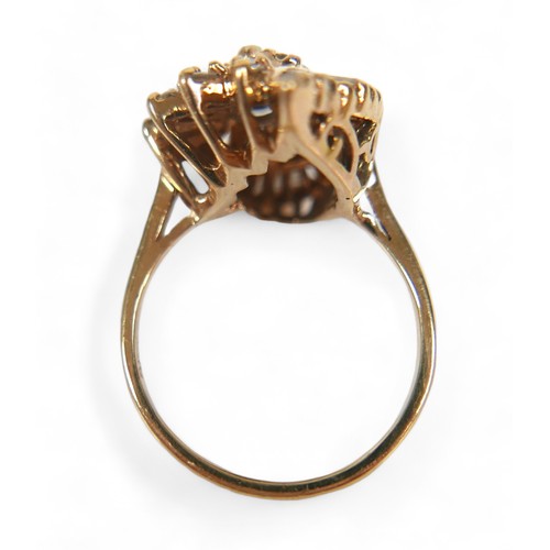 95 - A 14ct yellow gold and diamond cluster dress ring, circa 1970s, set centrally with a pear cut diamon... 