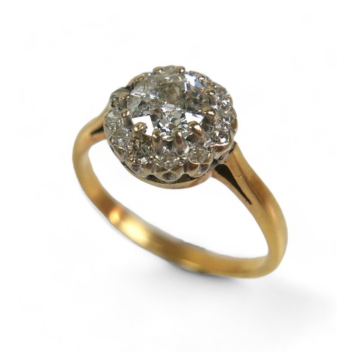 93 - An 18ct yellow gold and diamond ring, set centrally with an old cut stone, 6.1 by 3.7mm, 0.7ct, surr... 