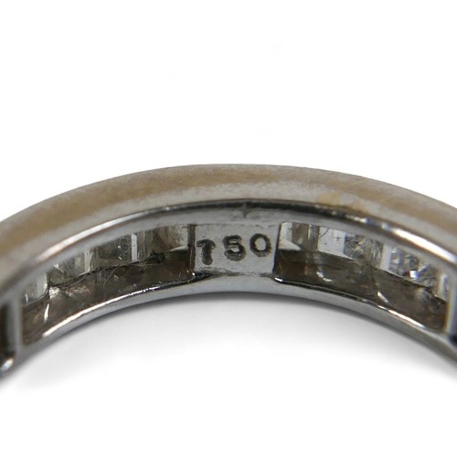 91 - An 18ct white gold and diamond full eternity ring, set with thirty six baguette cut stones, approxim... 