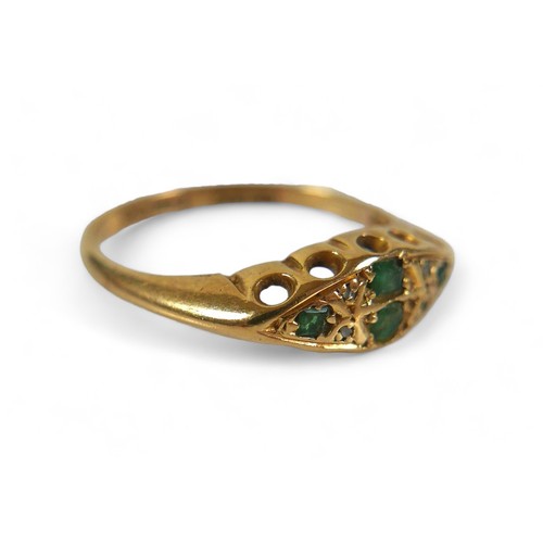 69 - An 18ct gold, emerald and diamond ring, maker HW Ltd, Sheffield assay marks, size N. Comprising two ... 