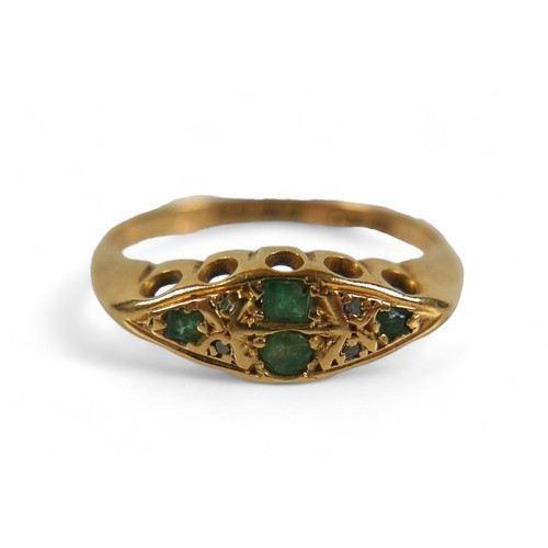 69 - An 18ct gold, emerald and diamond ring, maker HW Ltd, Sheffield assay marks, size N. Comprising two ... 