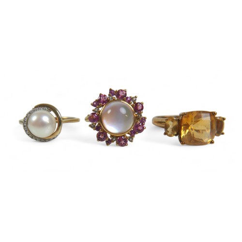 64 - A group of three 9ct gold ladies dress rings, comprising a three stone citrine ring, the central, cu... 