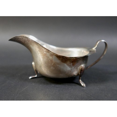 19 - A group of four silver items, comprising a sparrow beak cream jug, milk jug, sauce boat and sugar bo... 