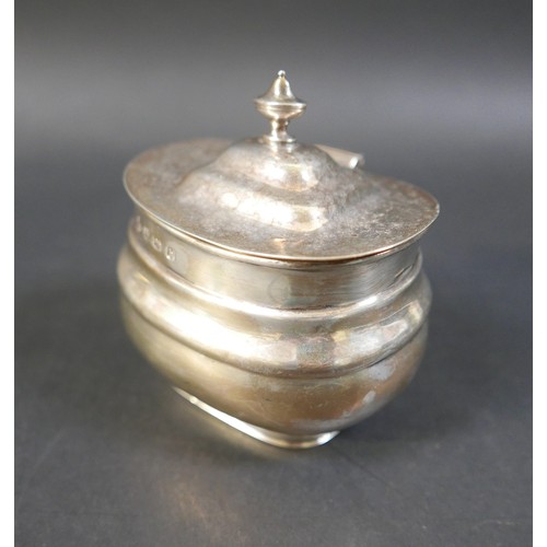 42 - A George V silver tea caddy, Sheffield 1925/26, and a silver spirit stopper with salmon finial, cadd... 