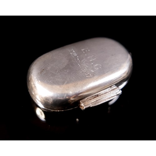 29 - An Edward VII silver twin sovereign holder, of rounded lozenge form with hinged cover, hinged catch,... 