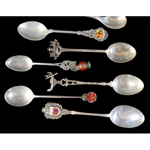 24 - A small collection of silver teaspoons, comprising two Georg Jensen Danish silver teaspoons, one pla... 