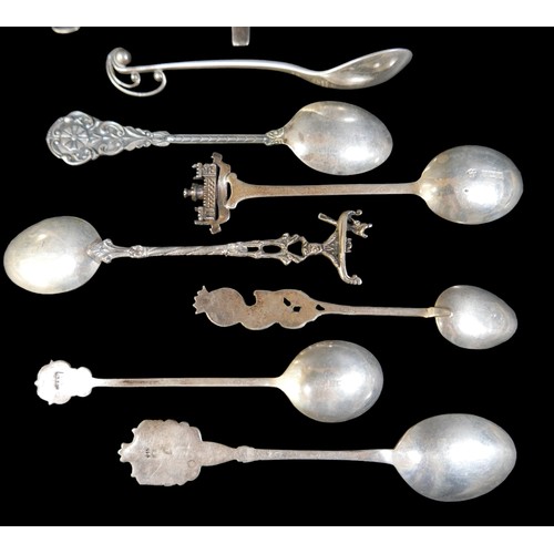 24 - A small collection of silver teaspoons, comprising two Georg Jensen Danish silver teaspoons, one pla... 