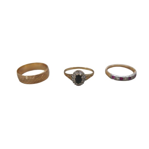 72 - Three 9ct gold rings, comprising an illusion set blue sapphire, the oval cut sapphire 4 by 5.5mm, si... 