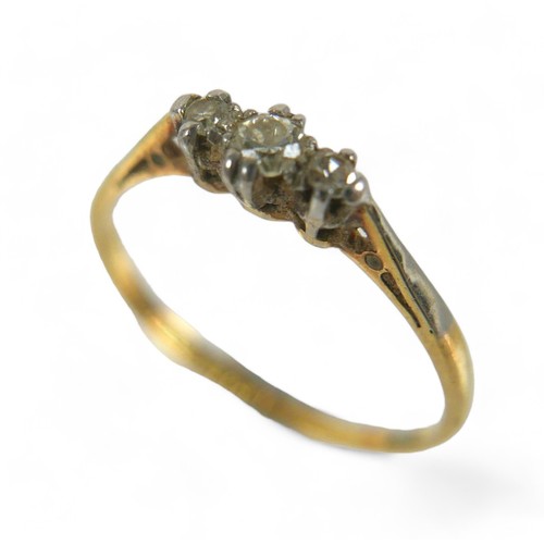 71 - An 18ct gold and diamond three stone ring, maker RK & T, size O.