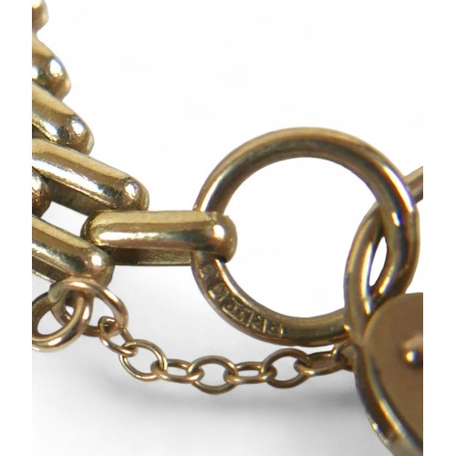 83 - A 9ct yellow gold gate link bracelet, with heart shaped padlock, 19.0g.