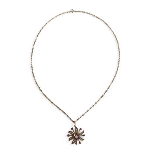 75 - Two pendant necklaces, comprising, a 9ct yellow gold chain, 4.0g, with a gold sunburst flowerhead pe... 