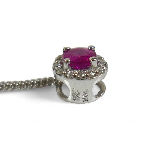 53 - A 9ct white gold thin chain, marked 375, together with a circular diamond set pendant with pink ston... 