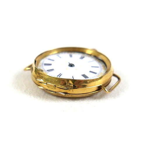 103 - A 9ct yellow gold wristwatch head, circa 1905, being a very early wristwatch with pocket watch body ... 