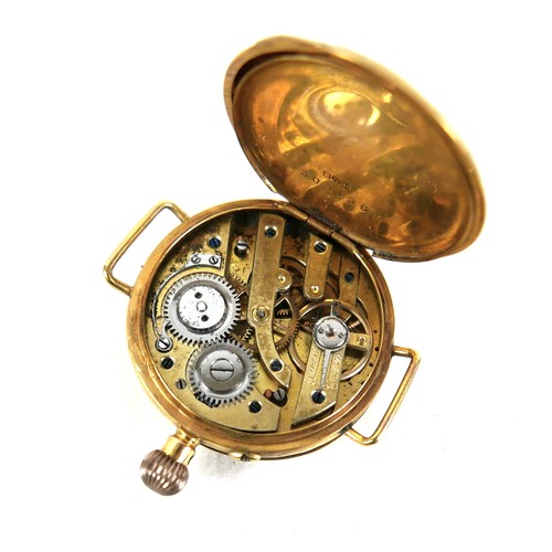 103 - A 9ct yellow gold wristwatch head, circa 1905, being a very early wristwatch with pocket watch body ... 