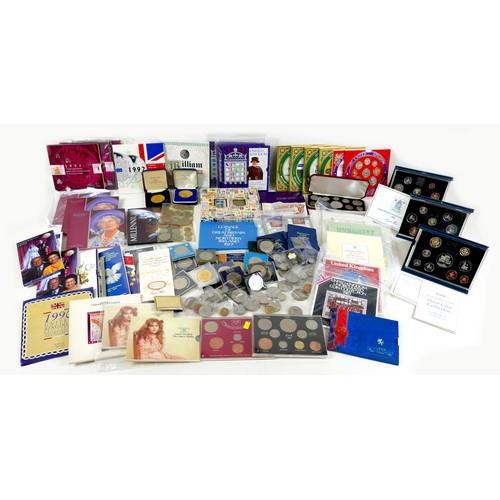 121 - A collection of UK coin sets, commemorative coins and assorted coins, and others, including two 1986... 