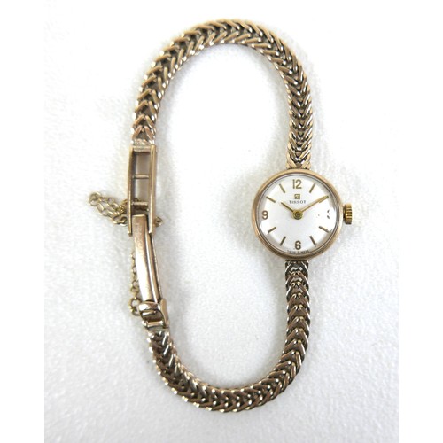 106 - A Tissot 9ct yellow gold lady's bracelet wristwatch, manual wind, silvered dial with gold baton and ... 