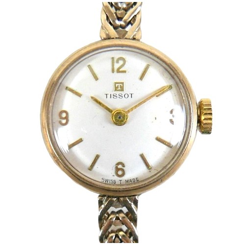 106 - A Tissot 9ct yellow gold lady's bracelet wristwatch, manual wind, silvered dial with gold baton and ... 