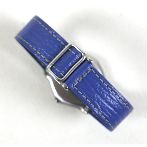 110 - An Ebel Sport Classique stainless steel quartz wristwatch, on a blue leather strap, 34mm case, with ... 