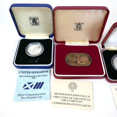 116A - A group of UK silver proof coin sets, to include 1990 silver proof 5p 2-coin set, £1 silver proof pi... 