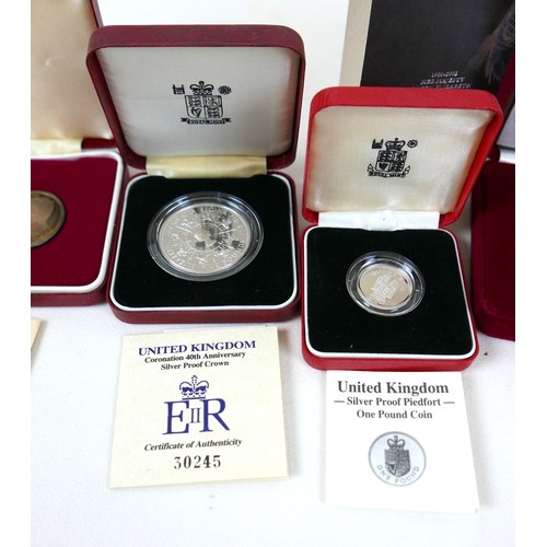 116A - A group of UK silver proof coin sets, to include 1990 silver proof 5p 2-coin set, £1 silver proof pi... 