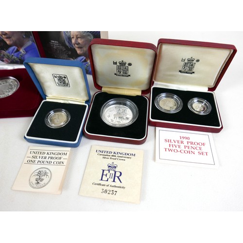 116A - A group of UK silver proof coin sets, to include 1990 silver proof 5p 2-coin set, £1 silver proof pi... 