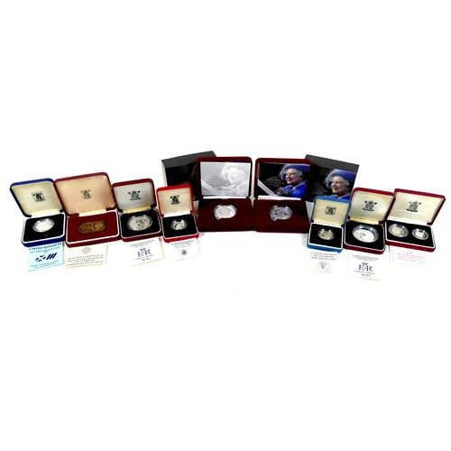 116A - A group of UK silver proof coin sets, to include 1990 silver proof 5p 2-coin set, £1 silver proof pi... 