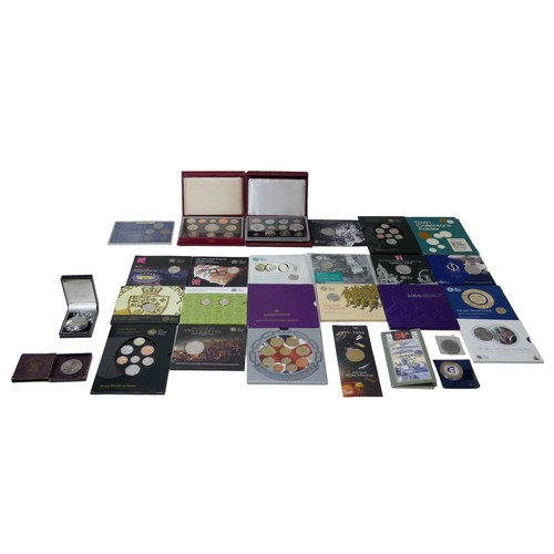 117 - A large collection of British coin sets, including Royal Mint brilliant and uncirculated coin collec... 