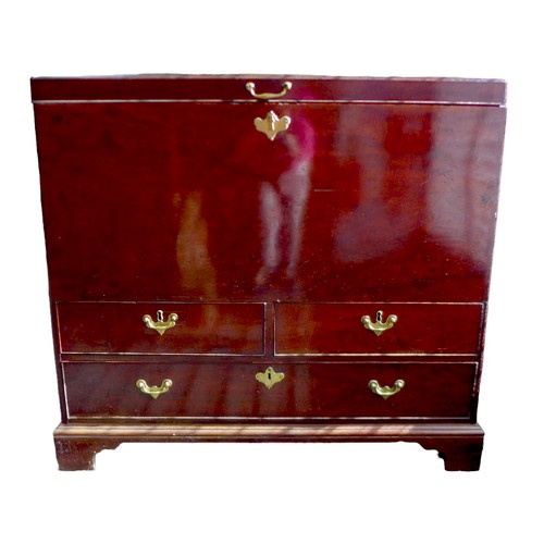 570 - An 18th century mahogany robe chest, with brass handles to the side, two drawers below, raised on br... 