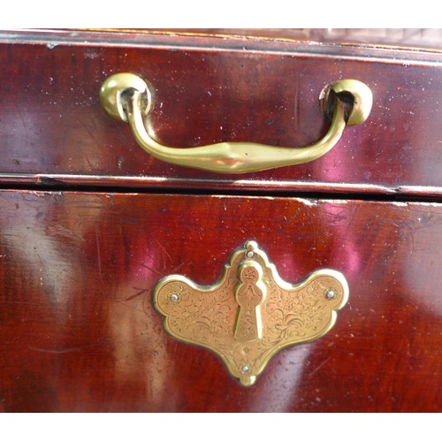 570 - An 18th century mahogany robe chest, with brass handles to the side, two drawers below, raised on br... 