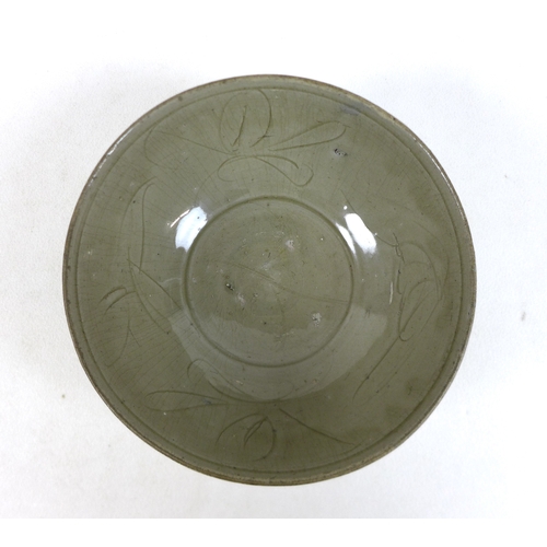 175 - A Chinese Longquan-type celadon bowl, decorated incised decoration of leaves to the inside, asymmetr... 