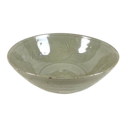 175 - A Chinese Longquan-type celadon bowl, decorated incised decoration of leaves to the inside, asymmetr... 