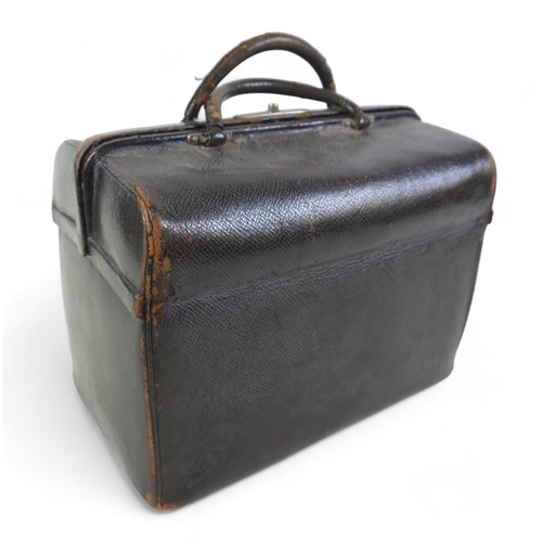 387 - A late Victorian leather fitted travel case with a fitted interior housing bottles and brushes, with... 