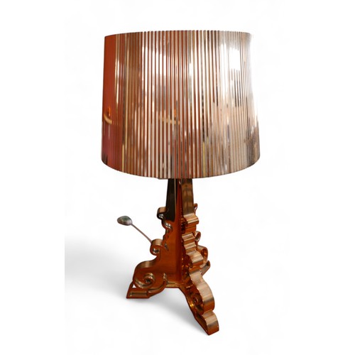 390 - A Kartell Bourgie perspex table lamp, copper finish, designed by Ferruccio Laviani, 32 by 69cm high.