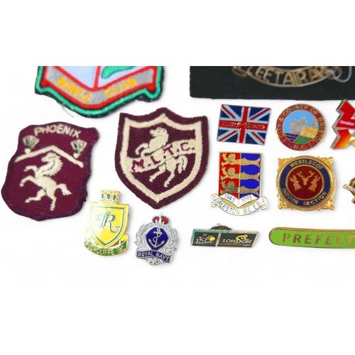 276 - A collection of pin and cloth badges, including some militaria, 'Fleet Air Arm', as well as a number... 