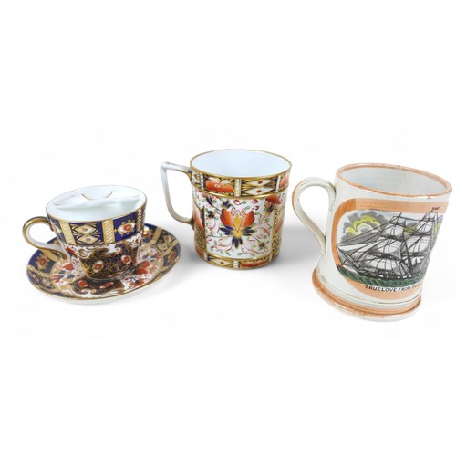 206 - A Crown Derby Imari palette tankard, an Imari palette moustache cup and saucer, and a maritime frog ... 