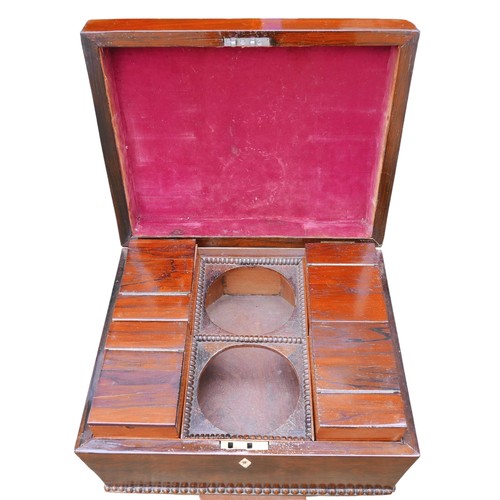 529 - A Regency rosewood teapoy, with four internal caddies, raised on a lyre support and quatrefoil splay... 