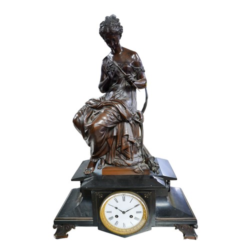 346 - A Victorian bronze and black marble mantel clock, with large bronze figural surmount modelled as Dia... 