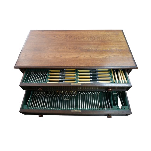 374 - An oak two drawer canteen of silver plated cutlery, circa 1940, twelve place settings, missing one t... 