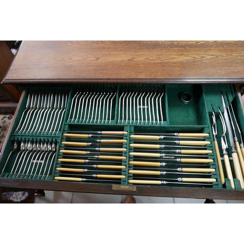 374 - An oak two drawer canteen of silver plated cutlery, circa 1940, twelve place settings, missing one t... 