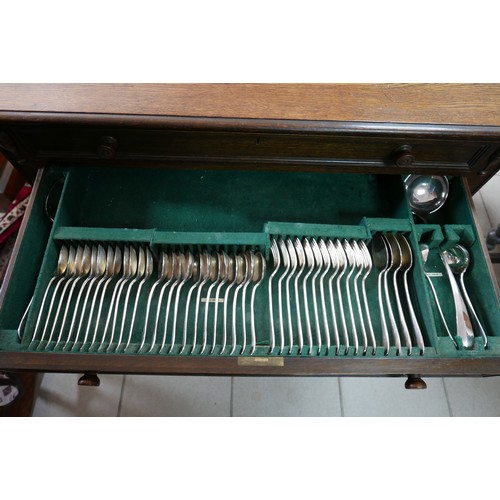 374 - An oak two drawer canteen of silver plated cutlery, circa 1940, twelve place settings, missing one t... 