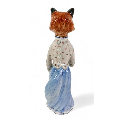 217 - A Cinque Ports pottery 'Felicity Fox' figurine, wearing a light blue skirt and holding a fan, rare c... 