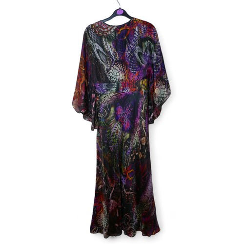 269 - A late 20th century Biba dress, size 12, purple snakeskin effect design on black ground, 140cm neck ... 