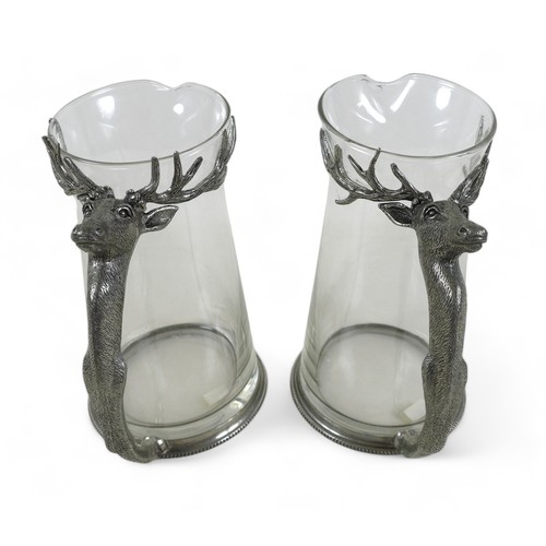 245 - A pair of decorative water jugs with cast deer head handles, 22.5cm high. (2)