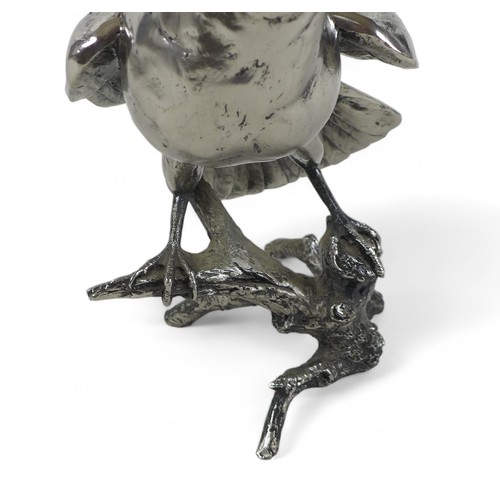 262 - A Keith Sherwin nickel resin sculpture of a falcon, perched on a branch, 17.5 by 20 by 24cm high.