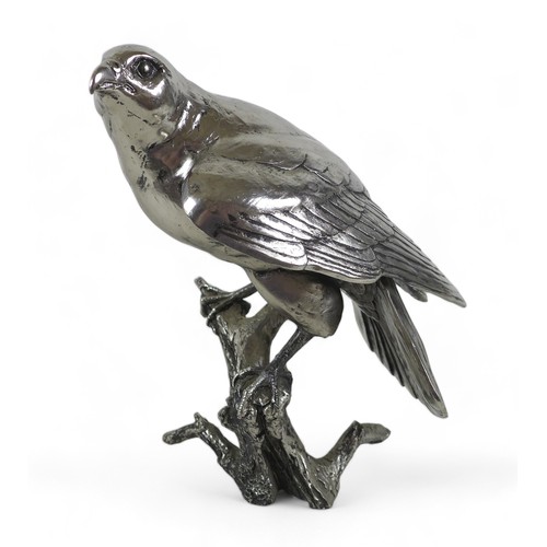 262 - A Keith Sherwin nickel resin sculpture of a falcon, perched on a branch, 17.5 by 20 by 24cm high.