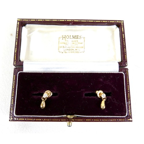 100 - A pair of diamond and gold earrings, each set with single diamond solitaire of approximately 0.1ct a... 