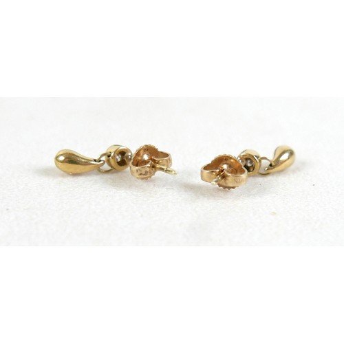 100 - A pair of diamond and gold earrings, each set with single diamond solitaire of approximately 0.1ct a... 